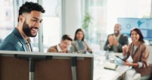 Leader, happy businessman and whiteboard for presentation, training or compliance officer coaching.